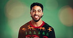Happy man, face and Christmas jersey in studio, lens flare and excited with style on green background. Person, smile and celebration in portrait, mockup space or pride in xmas sweater in Mexico