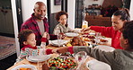 Happy family, christmas and holding hands with food at dining table for festive feast in home. Parents, children or praying with gratitude for faith, meal or thanksgiving dinner together in house