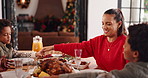 Happy family, holding hands and praying at dining table for christmas feast or thanksgiving in home. Mom, child or faith with gratitude or appreciation for dinner, food or get together in house