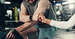Hands, cycling and fist pump with coach at gym for motivation, target or goals at fitness club. People, personal trainer or teamwork with exercise bike, cardio workout or wellness at training center