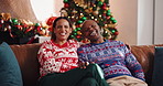 Christmas, hug and African couple with laugh, tree and love in living room of house together. Portrait, smile and man with woman, xmas and holiday or vacation bonding for festive season or tradition