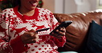 Happy woman, hands and christmas with phone or credit card for online shopping or festive order. Closeup, female person and banking app with mobile smartphone for holiday payment or ecommerce in home