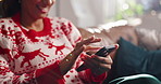 Christmas, home and woman on couch, cellphone and scroll with smile, festive and relax in lounge. Xmas, tradition and person on sofa, happiness and smartphone with holiday season and online reading