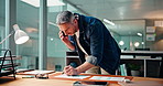 Businessman, writing or phone call with documents at night for analysis or statistics in office. Man, employee or talking with paperwork on mobile smartphone for risk management or performance review