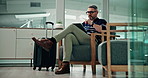 Airport lounge, relax and man with luggage, tablet and travel with journey, notification and internet. Mature person, delay and employee with tech, online reading or waiting with communication or app