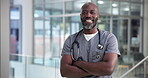 Doctor, face or black man with arms crossed in clinic for medical help, health service or confidence. Surgeon, mature person and happy in hospital for healthcare work, about us and ready for medicare