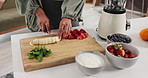 Person, hands and meal prep with fruit for diet, smoothie or healthy ingredients for drink in home. Nutritionist, cut and preparation with banana, strawberries or natural organic food for weight loss