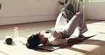 Pilates ring, woman and exercise on floor for fitness, wellness or training with glute bridge. Workout equipment, mat and resistance circle for muscle, core strength and health with person in gym