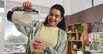 Woman, blender and pour smoothie in kitchen with glass, nutrition or excited for wellness at house. Person, machine and liquid diet with drink, milkshake and happy for detox for gut health at home