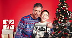 Christmas, smile and face of father and son in studio for holiday season, hug and bonding. Festive celebration, love and December break with man and child on red background for family and support