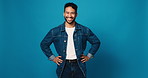 Happy man, face and fashion with confidence in studio for denim outfit on a blue background. Portrait, male person or model with smile for stylish clothing, garment or casual style on mockup space