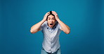 Face, surprise and man in studio, excited and announcement on blue background. Portrait, space and person with facial expression, shocked or good news with winner, wow or discount deal with success