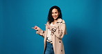Face, happy and pointing with woman in studio for feedback, announcement and sale news. Excited, female person and hand gesture for coming soon, information direction and giveaway on blue background