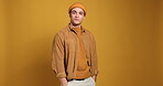 Face, fashion and man with pride, studio background or positive attitude with trendy outfit or space. Confident, cool and person with stylish clothes, mockup and trendsetter with smile in Canada