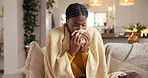 Cold, sick and black woman sneeze in home with allergies and virus infection with winter blanket. Tissue, blowing nose and person in living room with flu, health problem or disease with bacteria risk