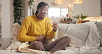 Black woman, pregnancy test and happy on sofa, home or touch belly for fertility confirmation. African person, pregnant and check results with excited for surprise, ivf success or stick at apartment