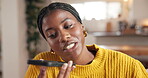 Black woman, phone call and gossip on speaker in home with voicemail recording, audio message and contact. Voice note, person and smartphone with discussion, conversation and networking in house