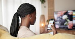 Black woman, relax and scroll with phone screen at house for research, online shopping and website. Female person, mobile and browsing social media for ecommerce, subscription and store information