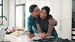 Happy couple, kiss and phone in kitchen, cooking and hug with bonding, search or recipe in home. Man, woman and embrace with smartphone, mobile app or ingredients for diet with love at apartment