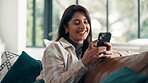 Happy, woman and texting with smartphone, lounge or communication with contact, app or social media. Smile, person and chat with mobile in living room, online and typing message on website in home