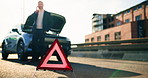 Warning triangle, car breakdown and man with phone call in road for engine fail, help or emergency. Safety sign, business person or talking to insurance agent for roadside assistance or vehicle issue
