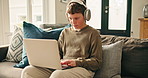 Laptop, headphones and kid in home for elearning, typing or studying with homework. Computer, student and boy with audio for distance education, online lesson or listen to virtual class for knowledge