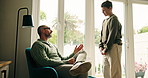 Talking, discipline and father with child in home with support, advice or communication on behavior. Discussion, family and dad with boy kid for grounding with punishment in living room at house.