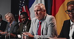 Press conference speech, politics and man with group, delegation or international government panel. Summit, people and politician talk at event for diplomacy discussion, global forum or policy update