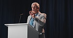 Talking, mature man and politician on podium for election, democracy or political campaign. Speech, microphone and male speaker at conference, meeting or seminar for vote for activism at convention.