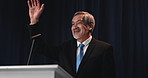 Greeting, mature man and politician on a stage for election, democracy or political campaign. Speech, microphone and male speaker at conference, meeting or seminar for vote for activism at convention