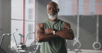 Mature black man, arms crossed and face at gym with pride, confidence and ready for challenge. African person, portrait and bodybuilder with wellness, health and muscle at training center in Kenya