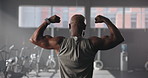 Exercise, black man and back view of flexing biceps, bodybuilder and fitness in gym. Athlete person, training and muscle goals for power, strength and pride for wellness and workout for progress