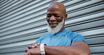 Athlete, man and check smart watch outdoor for fitness tracker, health app and monitor pace. Runner, mature black person and happy with timer for exercise performance, training results and progress