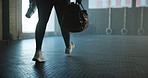 Walking, gym and legs of woman with bag ready to start training, exercise and workout space. Sports center, practice and person with gear, water bottle and kit for health, wellness and fitness