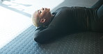 Breathing, fitness and black woman on floor in gym with rest for workout, exercise or cool down. Calm, relax and African person with break for body training with health and wellness in sports center.