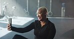 Woman, selfie and happy in gym for exercise, memory or fitness influencer with social media post. Laugh, fun and African female creator or athlete with smile in picture for wellness app at sport club