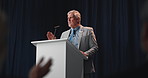 Speech, mature man and politician on a stage for election, democracy or political campaign. Applause, microphone and male speaker at conference, meeting or seminar for vote for activism at convention