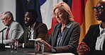 Politics, event or woman with tablet at press conference for campaign notes, delegation or feedback. People, global forum and government panel with discussion for policy decision or budget allocation