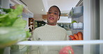 Decision, fridge and vegetables with black woman in kitchen of home for cooking or groceries. Diet, food and meal with pov of African person in apartment for healthy options or nutritional recipe