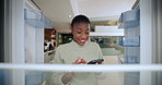 Phone, kitchen and black woman with empty fridge for online shopping, grocery order or virtual store. Close refrigerator, mobile and hungry person with pov, smile and meal purchase on app in home