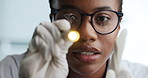 Black woman, face and light with checkup for medical response, reflex or brain function. Portrait, female person or healthcare worker with penlight exam or finger movement for eyes, nerve or reaction