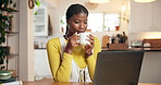 Coffee, laptop and black woman in home with reading news, celebrity gossip or online magazine. Cappuccino, happy and African female person with computer for morning research in apartment on weekend.
