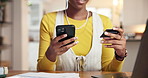 Hands, phone and woman with credit card in home for debt payment, internet banking and bills. Mobile, debit and person with financial technology for online shopping with budget, savings or investment