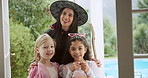 Face, halloween and mother with happy kids in home for holiday celebration with family portrait. Mom, pumpkin basket and children at party for tradition, laugh and girls smile with parent in costume