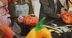 Halloween, children and drawing on pumpkin with hands, parent and learning in home. Kids, friends and holiday celebration with vegetable for decoration, writing or creative art with family at party