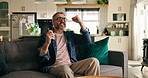 Mature man, celebration and watching tv on sofa with smile, cheers or winning goal for sports contest. Person, television remote and excited with streaming subscription, success and fist pump at home