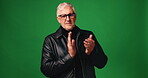 Face, mature man and applause in studio with sarcasm, fake support and rival success. Portrait, male person and slow clapping for mocking, jealous emotion and dislike achievement on green background