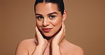 Skincare, beauty and face of woman with hands for shine, facial treatment and dermatology. Aesthetic, studio space and portrait of person with natural glow, cosmetics and wellness on brown background