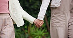 Person, child and holding hands for walk outdoor with love, travel journey and bonding together. Parent, kid and trust with support of holiday adventure, trekking guidance and helping on getaway trip