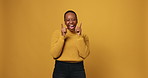 Black woman, face and point at you in studio, applause and mockup space on yellow background. African person, happy and excited with clapping hands, choice and finger guns for motivation in Kenya